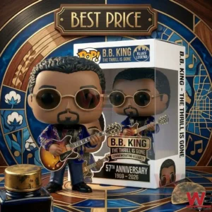 A detailed photograph capturing a B.B. King vinyl collectible figure in a blue and gold jacket, holding his sunburst guitar and wearing sunglasses, standing next to its decorative window box on a wooden pedestal! The intricate background is made of art deco stained-glass with wood framing! A sign above reads BEST PRICE! A small bottle and guitar pick are in the front!