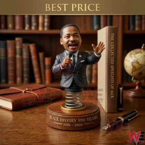 Martin Luther King Jr bobblehead figurine on a wooden desk.