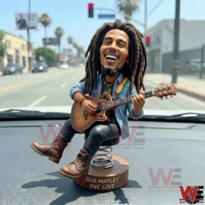 Musician bobblehead with guitar on a car dashboard!