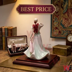 Rear view of a porcelain lady figure with a skeleton head and spine on a wooden desk!