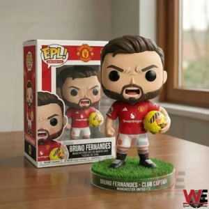 A vinyl collectible figure of Bruno Fernandes in a red football kit holding a ball next to its display box!