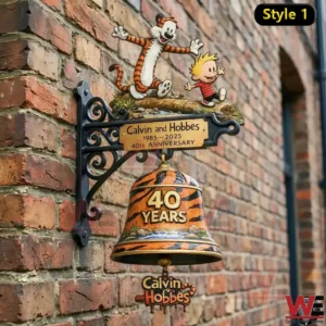 Calvin and Hobbes forty year anniversary wall bell mounted on a brick wall.