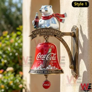 Coca Cola one hundred forty year anniversary wall bell with polar bear and red scarf mounted outdoors.