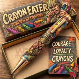 A specialty pen with military humor artwork resting in a green gift box on a wooden table!