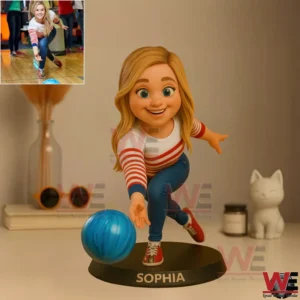 Cartoon style resin figure of a blonde woman bowling with a blue ball on a base labeled Sophia!