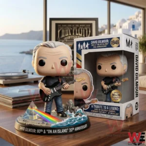 David Gilmour collector figure with guitar beside display box on a desk with ocean view!
