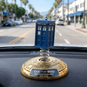 Blue Tardis anniversary bobblehead on a car dashboard!
