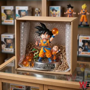 Dragon Ball Goku and Krillin Figure Doll 7 An open cardboard box containing a Goku figure and Krillin figure with dragon balls! The items are packed with shredded paper and bubble wrap! The box is on a glass table in front of shelves with many toys!