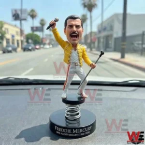 Singer anniversary bobblehead on a car dashboard!