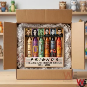 Friends 32nd Anniversary crayons 3 An open cardboard shipping box containing a Friends anniversary crayon set protected by bubble wrap! The box features the six main characters and colorful crayons! Small toy figures are visible on a shelf in the background!