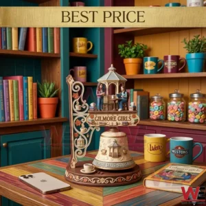 Collector Gilmore Girls bell with miniature figurines of Lorelai and Rory on a wooden table.