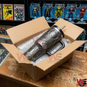 A Batman tumbler being unboxed in a room filled with superhero collectibles!