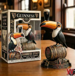 Guinness themed toucan figure on a decorated barrel base next to a matching display box!