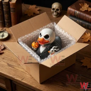 Top down view of a skeleton rubber duck being unboxed from a cardboard container with protective packaging!