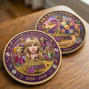 Two Hannah Montana anniversary collector coins on a wooden table!