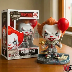 Vinyl clown figure with red balloon and paper boat accessory on a wooden surface.