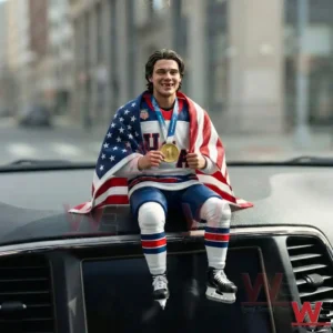 USA hockey figure wrapped in an American flag holding a gold medal on a car dashboard!