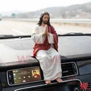 Praying Jesus figure sitting on a car dashboard!