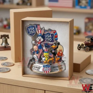 A Looney Tunes commemorative figure inside a cardboard shipping box with foam! Large silver coins and a model car are on the table next to it!