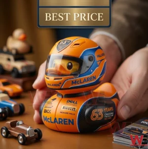 A detailed photograph of a McLaren themed collectible rubber duck in hands with vintage model cars.