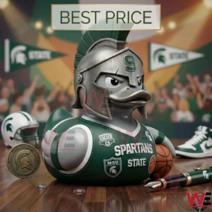 A Michigan State Spartans themed collectible duck wearing a silver helmet and holding a basketball on a court.