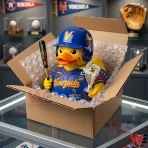 A Venezuela baseball themed rubber duck is packaged inside a cardboard shipping box with bubble wrap. The box is on a glass counter in a shop filled with baseball collectibles and team pennants.
