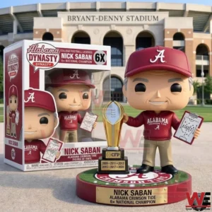 Alabama coach collectible figure with trophy and box in front of Bryant Denny Stadium!