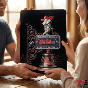 Ole Miss wall bell held by two people indoors!