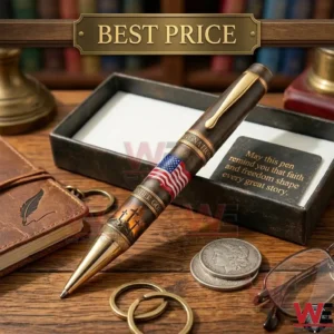 A high quality patriotic pen with a USA flag and religious symbols resting on a wooden surface with collector items!