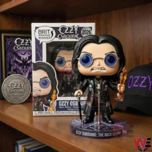 Ozzy Osbourne vinyl figure holding a trophy in front of its box on a wooden shelf!
