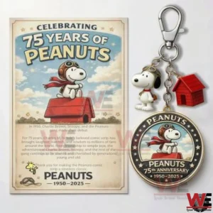 Peanuts anniversary poster beside a Snoopy keychain with a red doghouse charm!