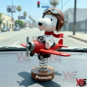 Snoopy pilot figure on a red airplane dashboard ornament!