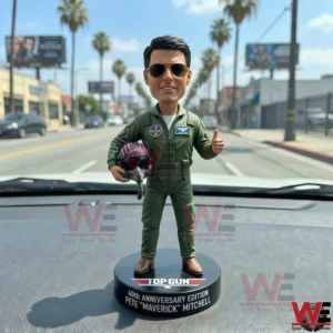 Top Gun Maverick bobblehead on a car dashboard!