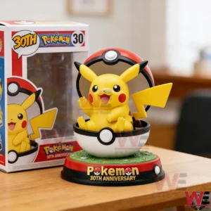Pikachu figure in a Pokeball display beside a Pokemon anniversary box!