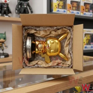 Pokemon Pikachu Gold Edition Pop Figure Doll 3 An unboxing view of a golden Pikachu collectible figure inside a shipping box with padding!