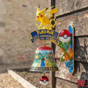 Pokemon wall bell with Pikachu figure above an anniversary sign and a painted hanging bell outdoors!