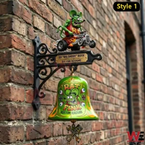 Green Rat Fink themed wall bell on a black ornate bracket mounted to a brick wall!