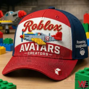 Red and blue Roblox Avatars Creators baseball cap with embroidered airplane design on a wooden table!