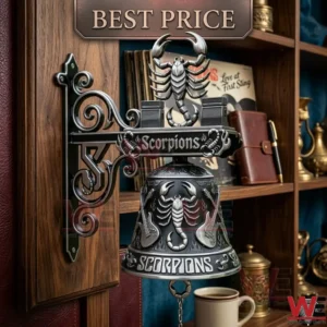 A metal rock band themed bell with silver scorpion and guitar details mounted on a wooden wall!