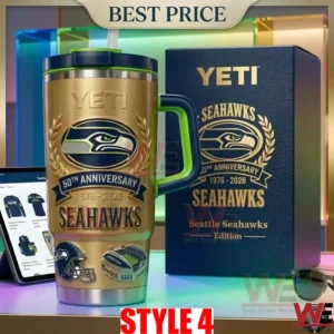 Gold 50th anniversary Seattle Seahawks tumbler with a blue and green handle next to a YETI box!