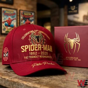 Maroon Spider Man anniversary cap and gold embossed box on a wooden table.