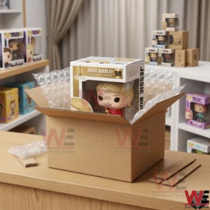 A Jessie Buckley collectible box inside a cardboard shipping box with bubble wrap on a store counter!