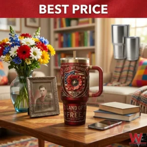 Red commemorative veteran tumbler with poppy flower design and military portrait on a desk!