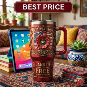 Detailed view of a patriotic red tumbler with poppy emblem and a tablet in a cozy room!