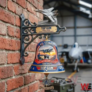 Top Gun anniversary wall mounted bell with jet figure on a brick wall!