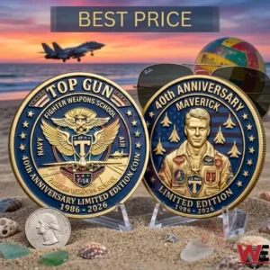 Commemorative Top Gun 40th anniversary coins displayed on a beach at sunset!