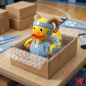 A North Carolina Tar Heels collectible duck figure packed in a cardboard box with bubble wrap.