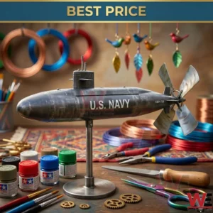 A metallic US Navy submarine model on a stand sits on a wooden desk surrounded by paint jars and workshop tools!