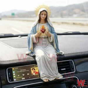 Sacred Heart Mary figurine on a car dashboard!