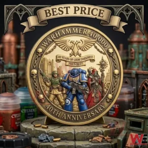 A golden Warhammer 40000 40th anniversary coin with detailed character engravings on a hobbyist workbench!